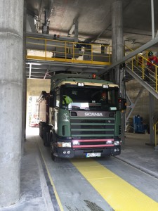 Truck positioned under gypsum loading spout